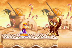 Un cake vampire sur le point de cracher une pépite de chocolat sur Rayman.