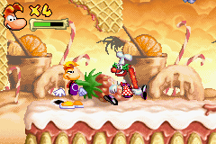 Un clown pâtissier approchant de Rayman.