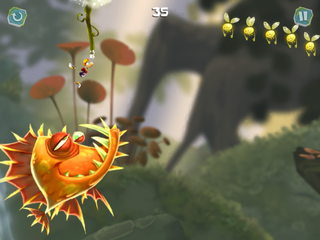 Rayman suspendu à un pissenlit, évitant de justesse une baudroie.