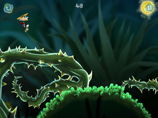 Rayman utilisant son hélicoptère pour survoler une ronce géante. Une attaque dévastatrice sur ces petites lentilles d'eau permet de rebondir jusqu'à cette pièce de la mort.