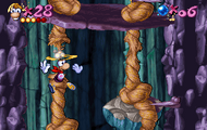Rayman używa swojej super mocy helikoptera, by przeciąć liny