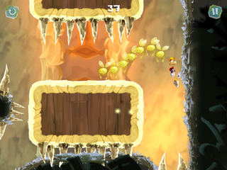 Rayman sautant entre deux murs pour atteindre une plate-forme avec des pointes en-dessous.