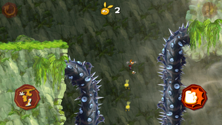 Rayman bondissant entre deux ronces géantes.