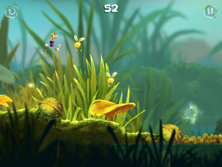 Rayman sautant au-dessus d'une fleur piquante fermée.