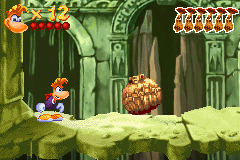 Scaleman rolls up into a ball to attack Rayman.