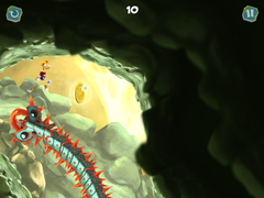 Rayman jumping over a spiky snake and towards a Skull Coin.
