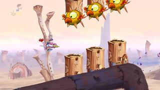 Spiky birds attached to didgeridoos.