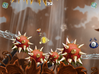Rayman flying over spiky flowers