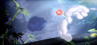 The hands of Rayman make shadow puppets before this Red Lum.