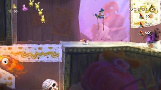 Rayman running past a Livingstone on stilts.