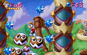 Rayman on a sprinkler, surrounded by spiky balls.